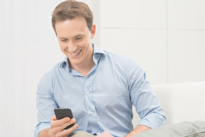 Man looking at Tinder on his phone