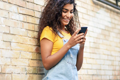 Badoo Profile Tips That Will Boost Your Match Rate 1 Woman texting on Badoo