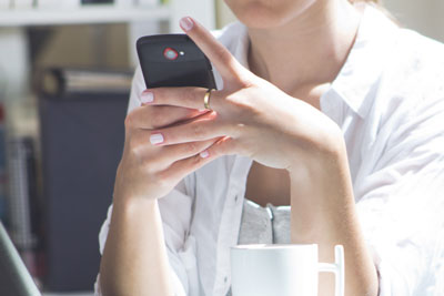 Young woman holding a cell phone