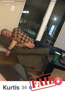 Primary Tinder photo of guy sleeping on recliner.