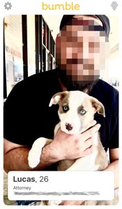 Man holding dog in a Bumble photo