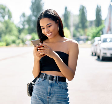 Woman smiling at a compliment she received on Bumble